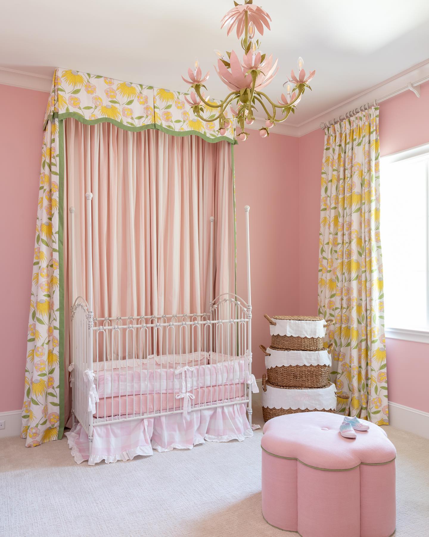baby girl nursery room inpsiration with pink walls, yellow floral curtains, and a Stray Dog Designs Lotus Chandelier