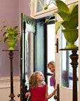 crunchberry papier mache plants flank enchanting entryway
