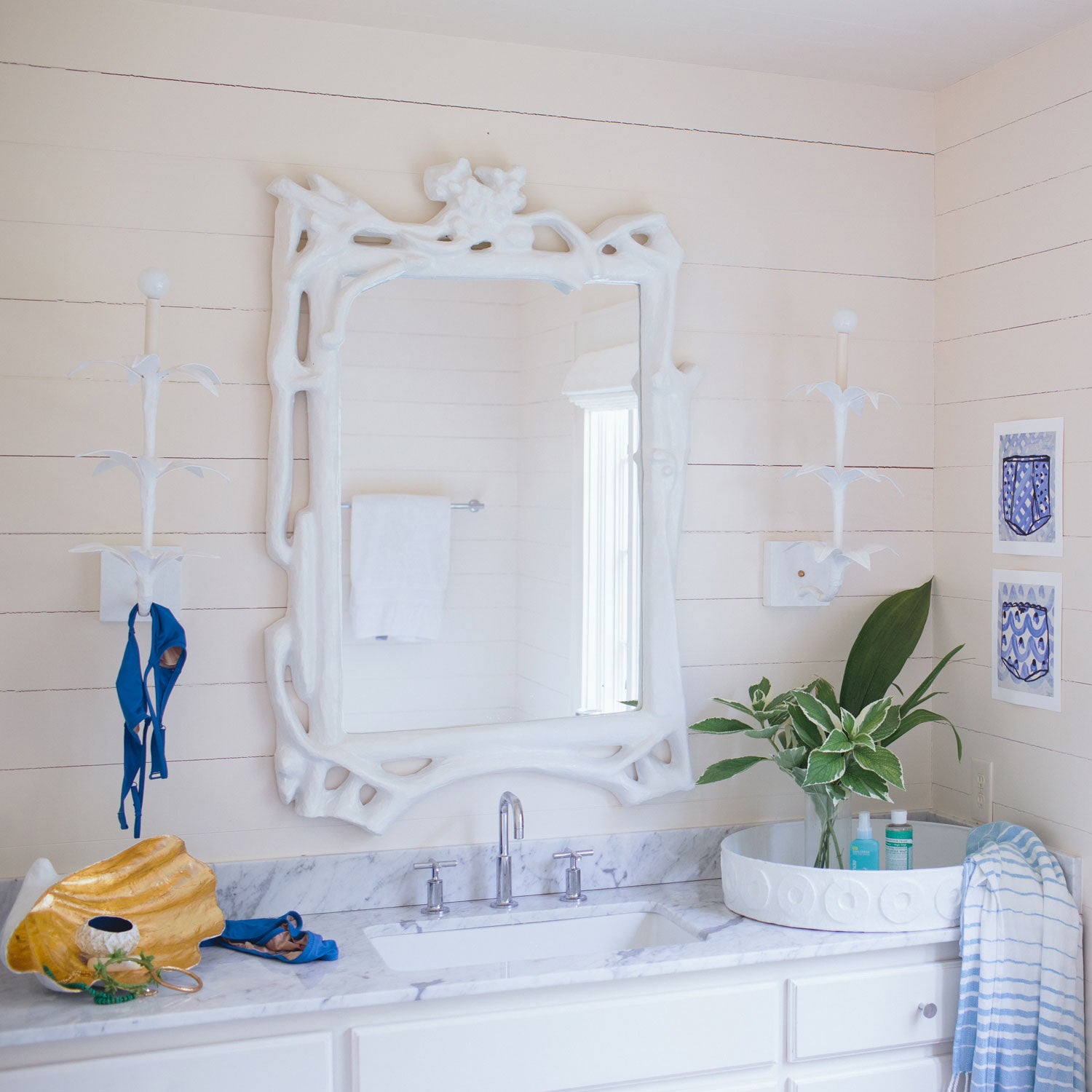 Magalie Mirror in a beachy bathroom, artisan made from papier mache.