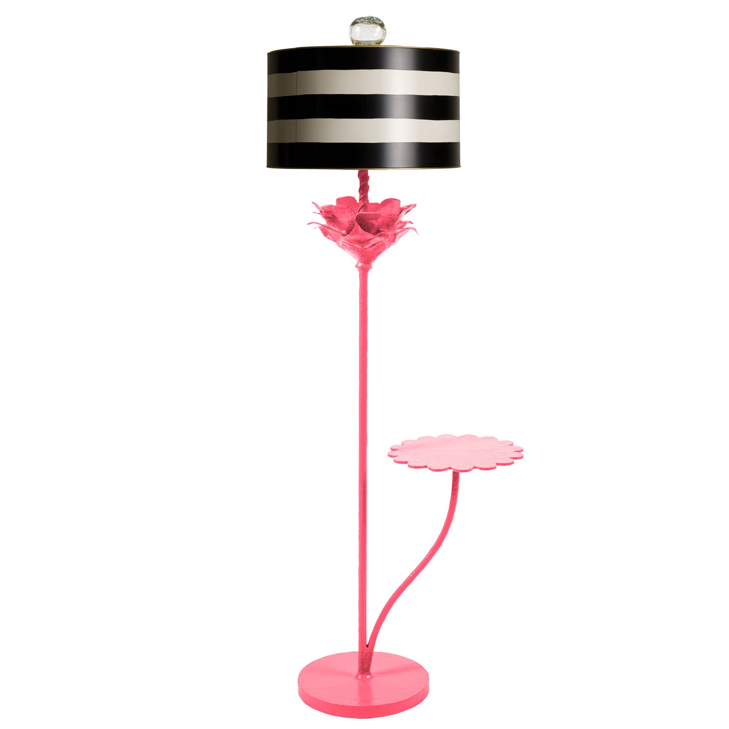 Pink papier mache floor light with black and white striped shade.